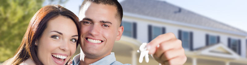 A newlywed couple buying a house.